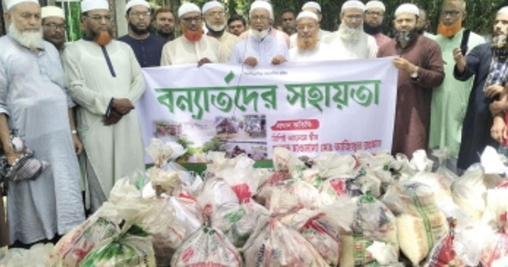 পৌর উন্নয়ন ও দরিদ্র স্বেচ্ছাসেবী সংগঠনের উদ্যোগে বন্যার্তদের মাঝে ত্রাণ বিতরণ